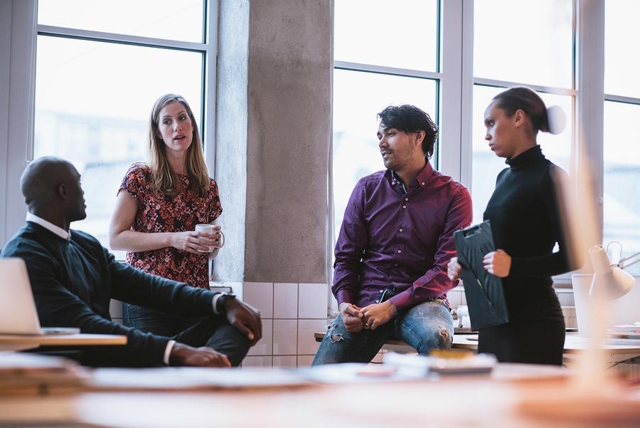 Diverse business team not communicating effectively