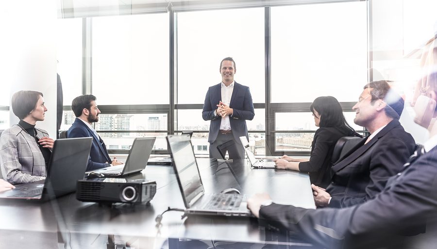 Manager Boosting Team Morale in Meeting